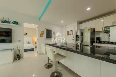 a kitchen and living room with a large counter top at Luxury beachfront Condo Edificio Morros 3 by Inmobiliaria MFR in Cartagena de Indias