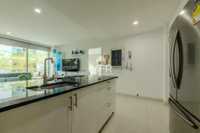 a kitchen with a sink and a refrigerator at Luxury beachfront Condo Edificio Morros 3 by Inmobiliaria MFR in Cartagena de Indias