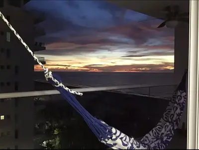 a hammock on a balcony with a view of the ocean at Cartagena Colombia in Cartagena de Indias