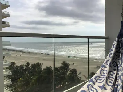 a balcony with a view of the beach and the ocean at Cartagena Colombia in Cartagena de Indias