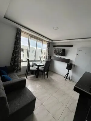 a living room with a couch and a table at Apto en Alameda del rio cunjunto ruiseñor 1 piso 5 in Barranquilla