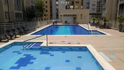 a large swimming pool in the middle of a building at Arriendo apto in Barranquilla