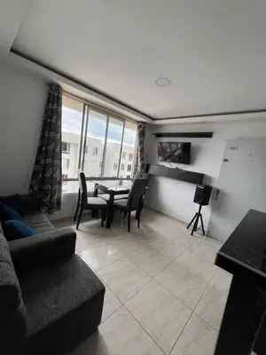 a living room with a couch and a table at ruiseñor 1 in Barranquilla