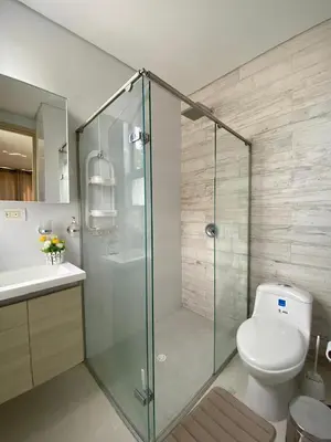 a bathroom with a toilet and a glass shower at 1 bedroom apartment close to the beach in Cartagena de Indias