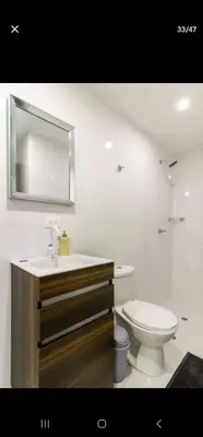 a bathroom with a toilet and a sink and a mirror at Marinares apartamento in Cartagena de Indias