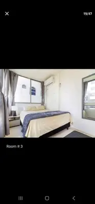 a room with two beds and a window at Marinares apartamento in Cartagena de Indias