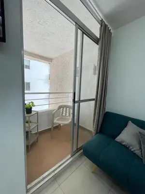 a living room with a couch and a window at Brisas del caribe in Cartagena de Indias
