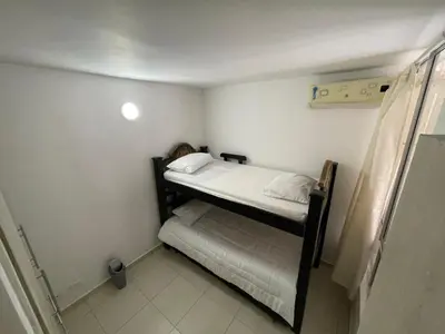 a small bedroom with a bunk bed in it at Brisas del caribe in Cartagena de Indias
