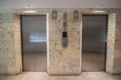 two metal elevator doors in a building at New & Comfortable Apartment 2 BR In Cielo Mar in Cartagena de Indias