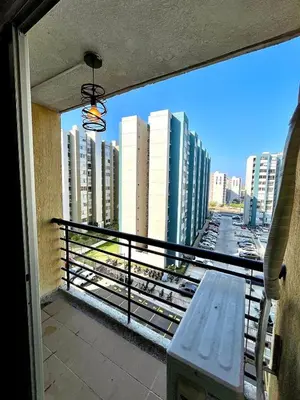 a balcony with a bench and a view of a city at Luxury loft with pool in Barranquilla