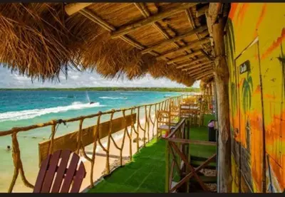 a view of a beach with chairs and the ocean at TESORO de BARU in Cartagena de Indias