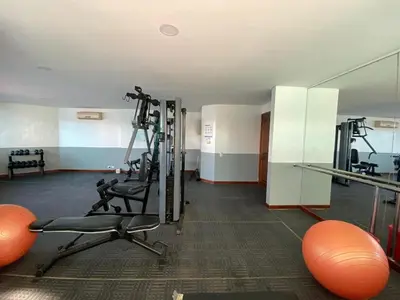 a room with a gym with exercise equipment at Laguito Apartment in Cartagena de Indias