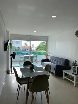 a living room with a couch and a table at Laguito Apartment in Cartagena de Indias