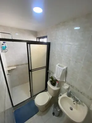 a bathroom with a toilet and a sink at Encanto Barranquillero! in Barranquilla