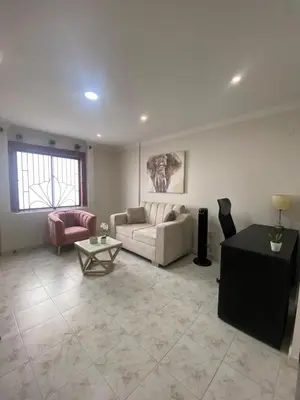 a living room with a couch and a table at Encanto Barranquillero! in Barranquilla