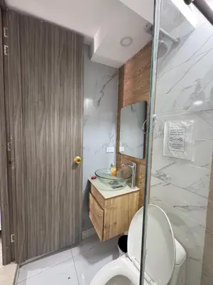 a bathroom with a toilet and a sink and a shower at Apartamentos Crespo 67 aeropuerto in Cartagena de Indias
