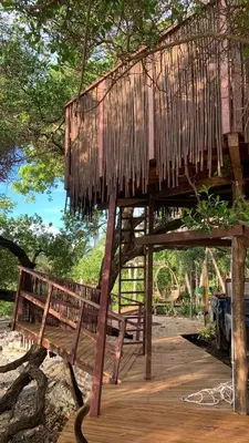 a tree house sitting on a wooden deck at COCO SALVAJE Tree House in La Rada