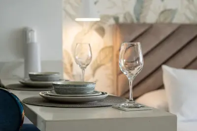 two wine glasses sitting on top of a table at CB910 | Suite frente al mar diseño moderno balcon in Cartagena de Indias