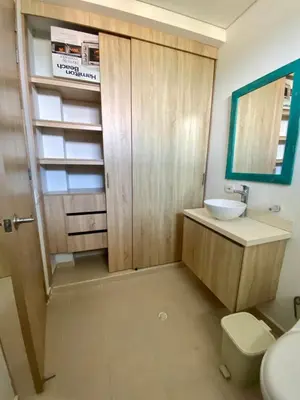 a bathroom with a sink and a toilet and a mirror at Fontainebleu in Coveñas