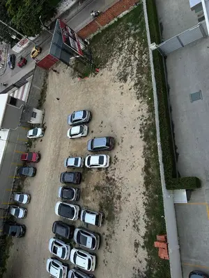 an overhead view of a group of cars parked in a parking lot at Cozy Beachside 3BR Apartment near the Walled City in Cartagena de Indias