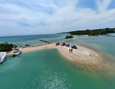 an aerial view of a beach with boats and umbrellas at Maravillosa Villa en Marina Baru enCartagena! in Isla Barú