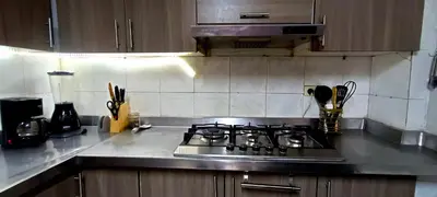 a kitchen with a stove top oven in a kitchen at Casa campestre Magyli in Puerto Salgar
