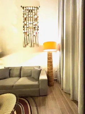 a living room with a couch and a lamp at THE LOFT 405 in San Basilio - La Matuna - Cartagena in Cartagena de Indias