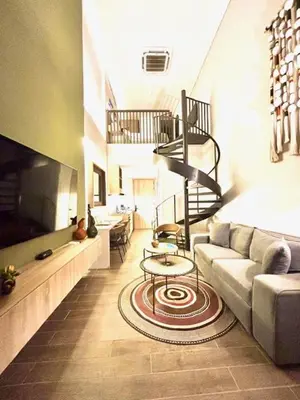 a living room with a couch and a table at THE LOFT 405 in San Basilio - La Matuna - Cartagena in Cartagena de Indias