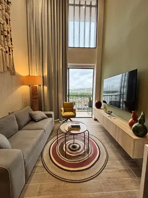 a living room with a couch and a tv at THE LOFT 405 in San Basilio - La Matuna - Cartagena in Cartagena de Indias
