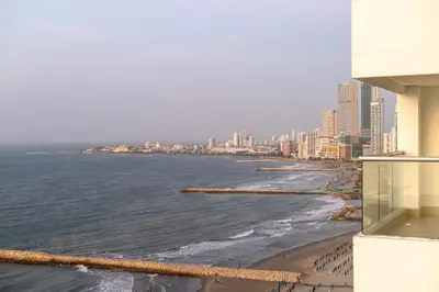 a view of a beach with buildings and the ocean at Majestic apt with an ocean view Palmetto Beach in Cartagena de Indias