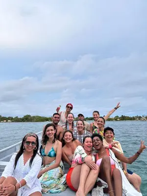 a group of people on a boat in the water at Casa Acuarimantima in Tintipan Island