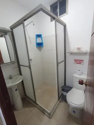 a bathroom with a shower and a toilet and a sink at Apartamento con piscina in San Silvestre