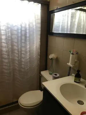 a bathroom with a white toilet and a sink at Apartamento Carnavalero calle 72, ubicación privilegiada eventos de carnaval zona norte in Barranquilla