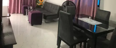 a living room with a table and a couch at La Armonia in Cartagena de Indias