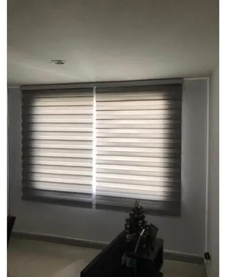a living room with a large window with blinds at Barranquilla Carnival 4 PX in Barranquilla