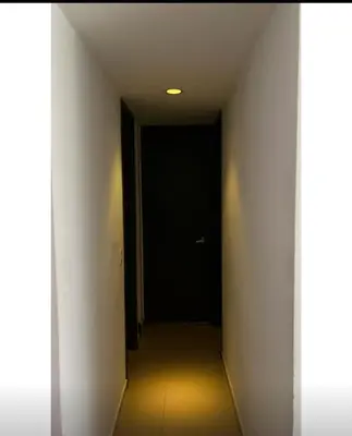 a hallway with a black door in a room at Barranquilla Carnival 4 PX in Barranquilla