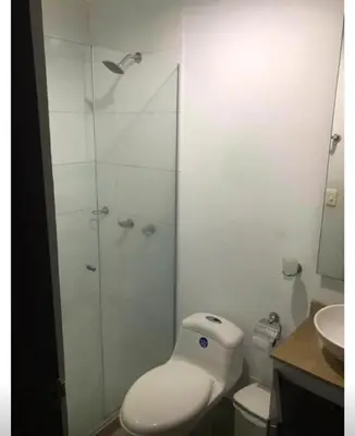 a bathroom with a shower with a toilet and a sink at Barranquilla Carnival 4 PX in Barranquilla