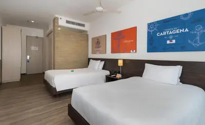 a hotel room with two beds at Pop Art Hotel CLC Puerto Mamonal Cartagena in Cartagena de Indias