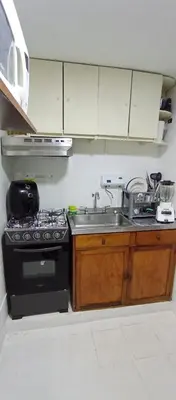a kitchen with a sink and a stove at Apartamento al norte de Barranquilla in Barranquilla