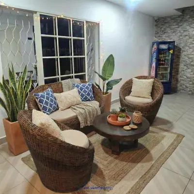 a living room with two chairs and a couch and a table at Casa Plenitud Lux in Cartagena de Indias