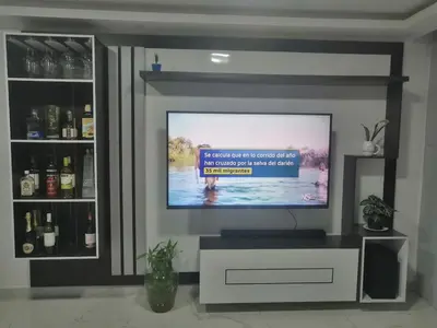 a flat screen tv sitting in a living room at Alquiler Apartamento Amoblado in Barranquilla