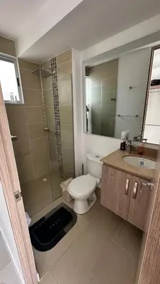 a bathroom with a toilet and a shower and a sink at Norte de Barranquilla in Barranquilla