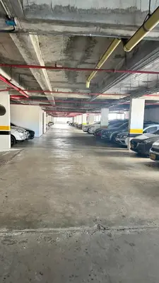 an empty parking garage with cars parked in it at Norte de Barranquilla in Barranquilla