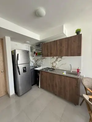 a kitchen with a stainless steel refrigerator and a sink at Beautiful Ocean view apartment in Cartagena de Indias