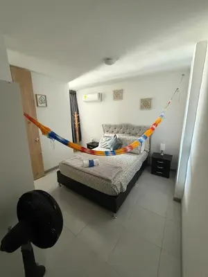a bedroom with a bed with a hammock in it at Beautiful Ocean view apartment in Cartagena de Indias