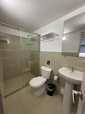 a bathroom with a toilet and a shower and a sink at HS-C Habitación Cuádruple con aire acondicionado y piscina in Cartagena de Indias