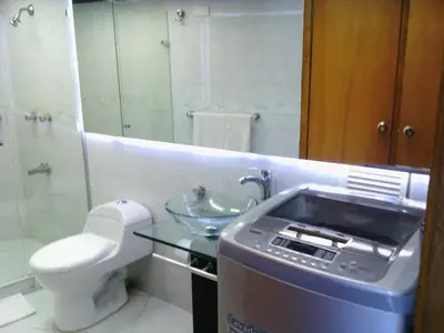 a bathroom with a sink and a toilet and a mirror at Arriendos S.H. Nuevo Conquistador in Cartagena de Indias