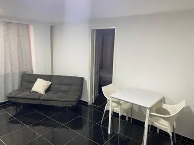 a living room with a couch and a table at Apartamento en Bocagrande muy cerca al mar! Apto 401 in Cartagena de Indias