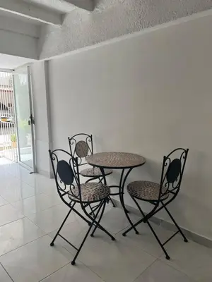 two chairs and a table and a table and chairs at Apartaestudio Marbella in Cartagena de Indias