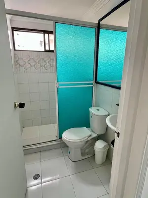 a bathroom with a toilet and a shower at Portofino Apartments in Cartagena de Indias